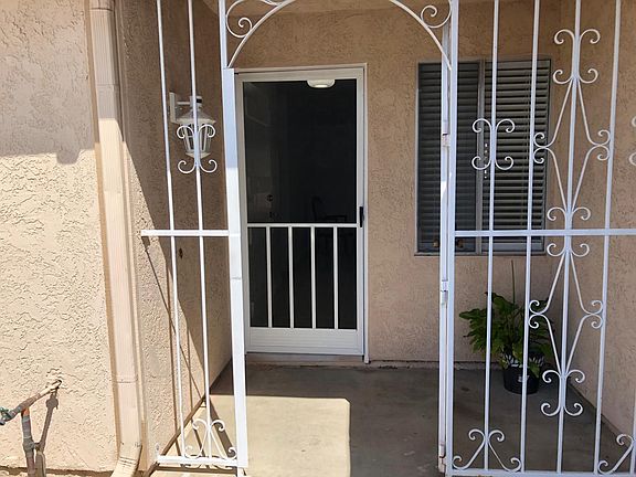 GATED PORCH ENTRANCE, ENTRANCE SECURITY CAMERA