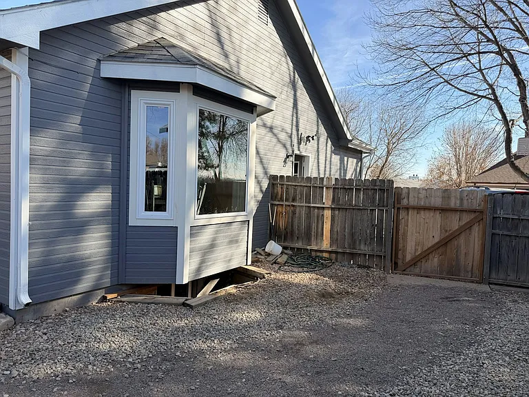 Side gate and new bay windows