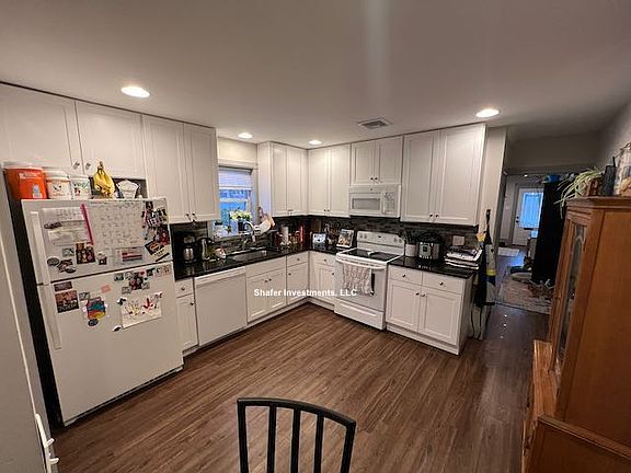 This photo showcases a second view of the kitchen.