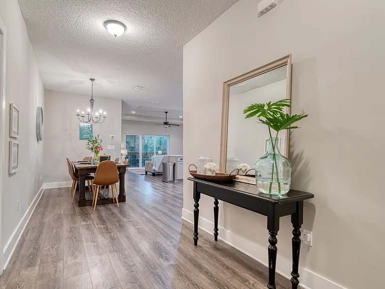 Welcome to the Coastal Soul Beach House! Step into a bright, airy foyer thoughtfully designed with modern coastal accents to welcome you home the moment you walk through the door