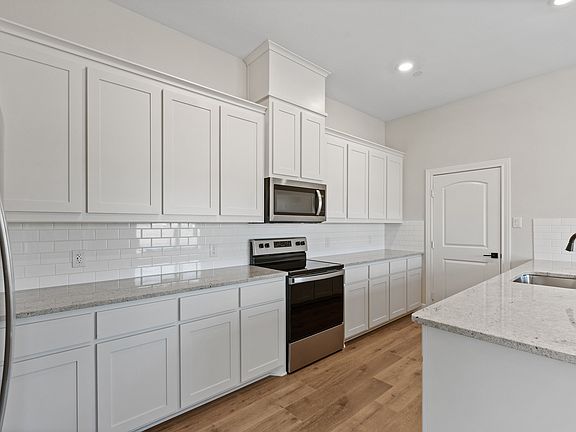 The Caspian has beautiful white kitchen cabinetry.