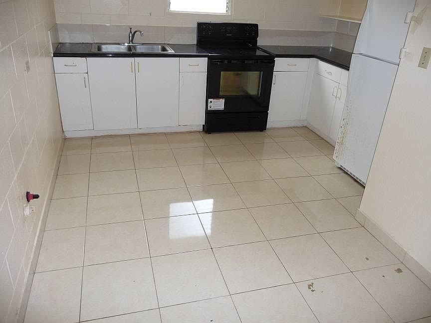 Large tiled open kitchen