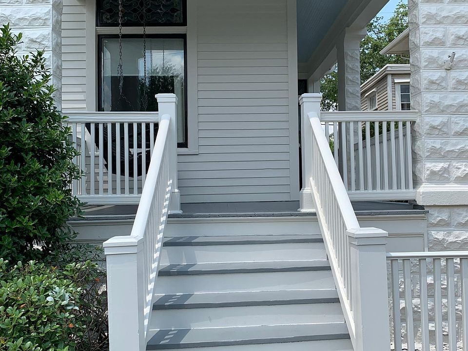 Front entry with porch swing.