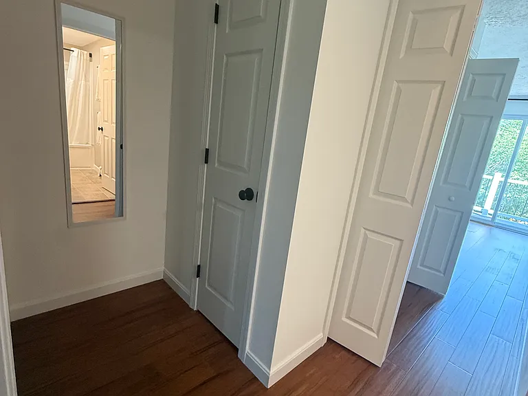 Hallway view showing linen and laundry closets