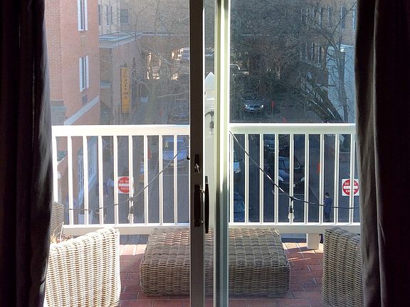 View out double doors to brick terrace