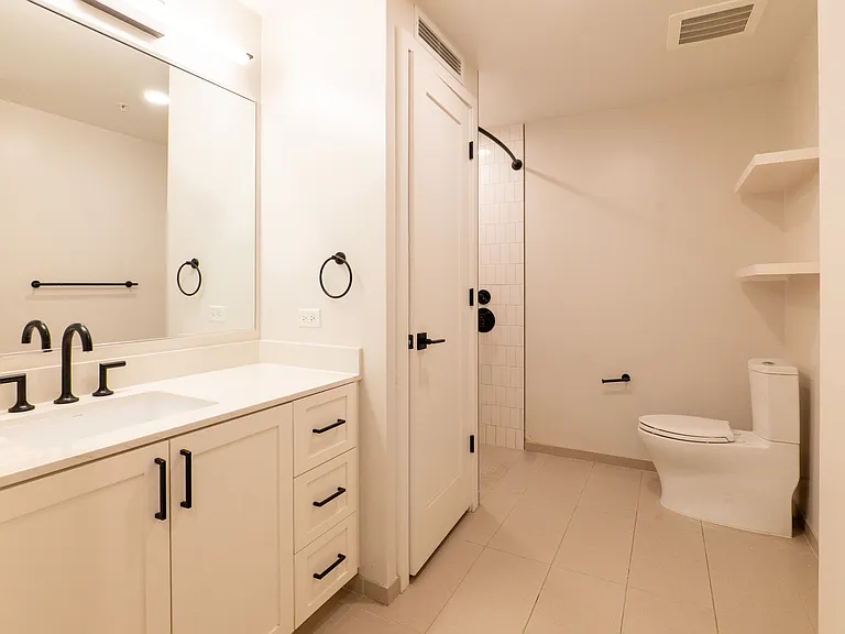 Full bathroom with shower and washer-dryer