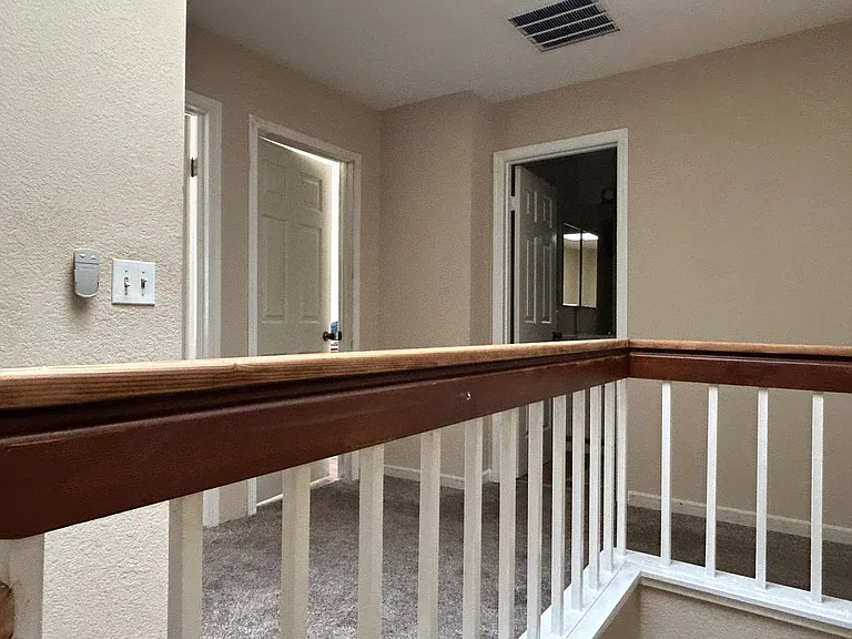 Hall entry to bedrooms and bath.