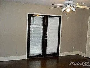 Third bedroom french doors open to private patio.