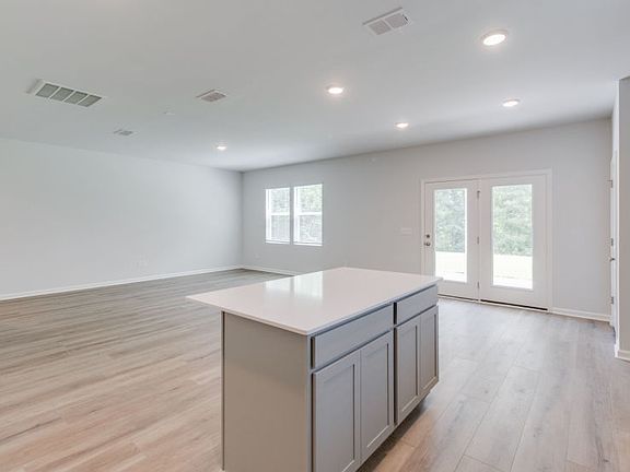 The large gathering room serves as the heart of the home, guests to come together.