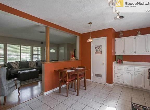 Open kitchen with tile floors.