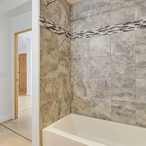 Both downstairs and upstairs bathrooms in 3202 "The Edward" Loft have tub/shower combination.