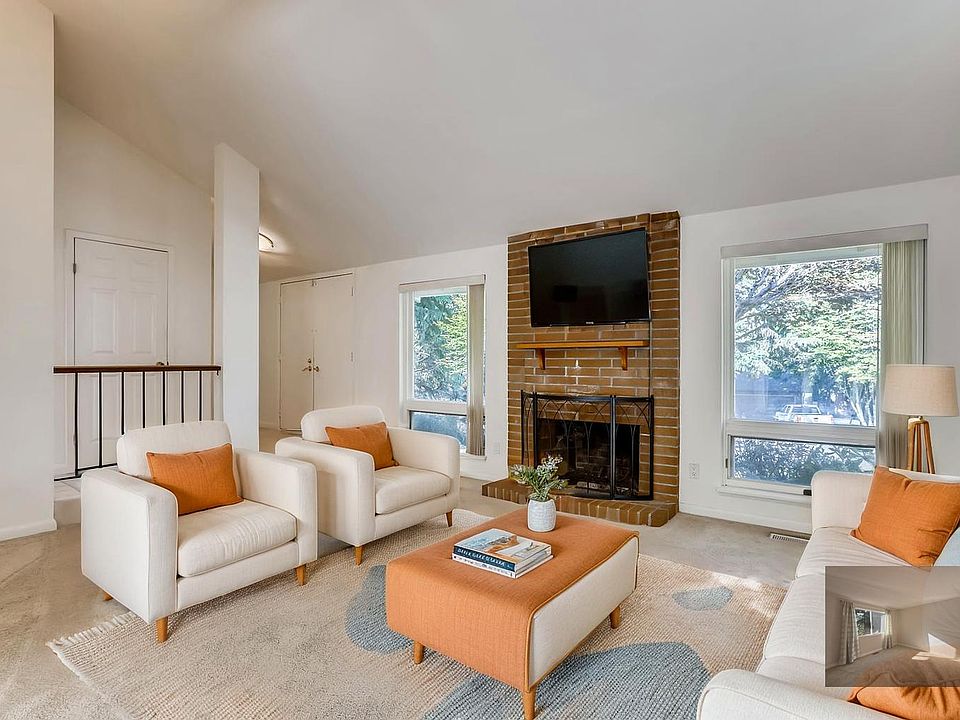 Virtural Staged, high ceiling living room with fireplace