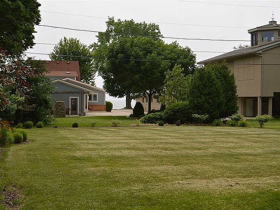 Deep back yard with views of water.