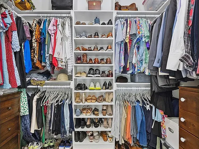 Huge walk-in closet, part of the addition that borrowed space from the other half of the duplex