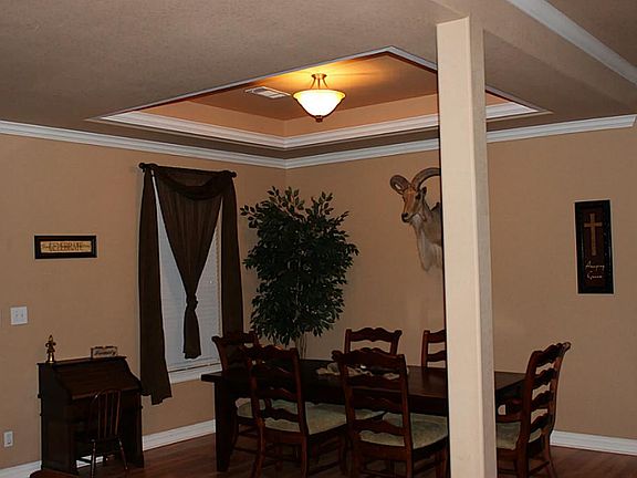 Dining room off the front entrance and opens into the living area. Great open entertaining space.