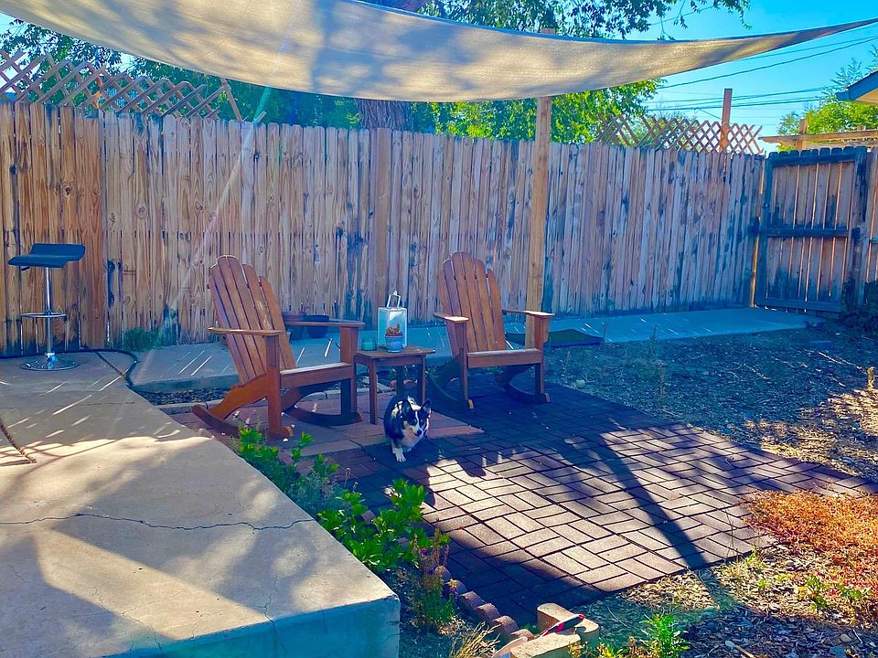 Large private fenced yard with shade structure