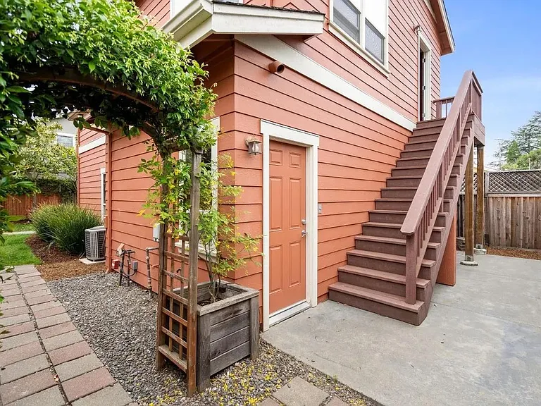 Entrance to private one car garage and stairs to apartment's front door.