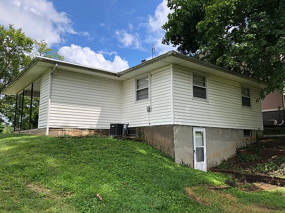 Back of house with walk-out basement.
