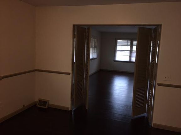 NICE WOOD FLOORS-DINING ROOM VIEW INTO LIVING ROOM