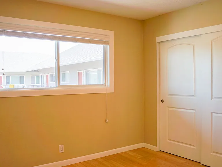 Top-Floor 2-Bedroom with Bamboo Flooring + Off-Street Parking! — Photo 7