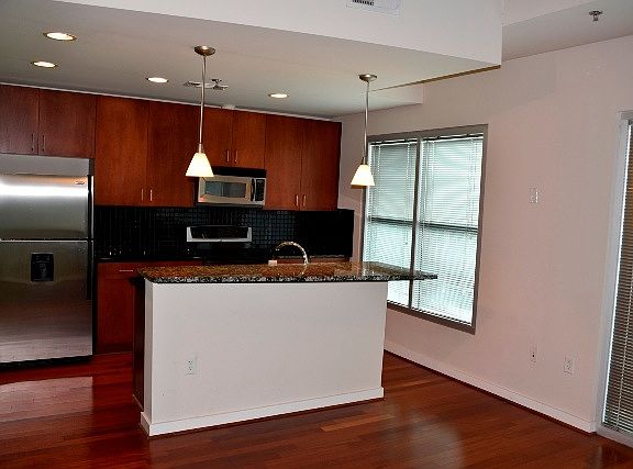 Kitchen featuring Stainless Steel appliance and granite top,