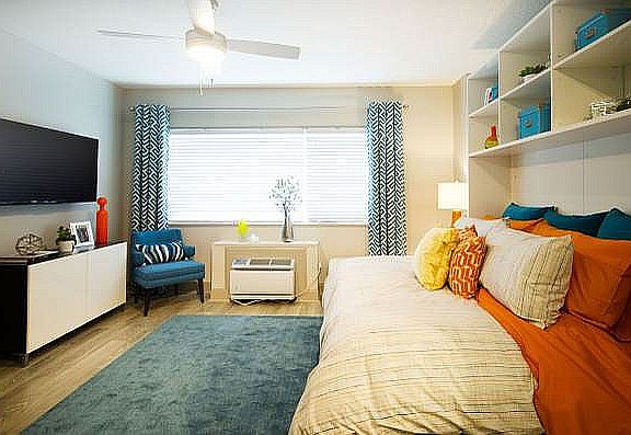 Bedroom with hardwood-style flooring