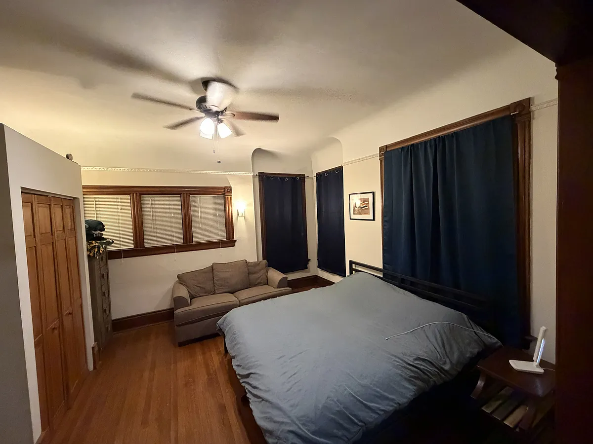 Bedroom & closet, gas fire place to the left. - 1560 E Irving Pl #1560