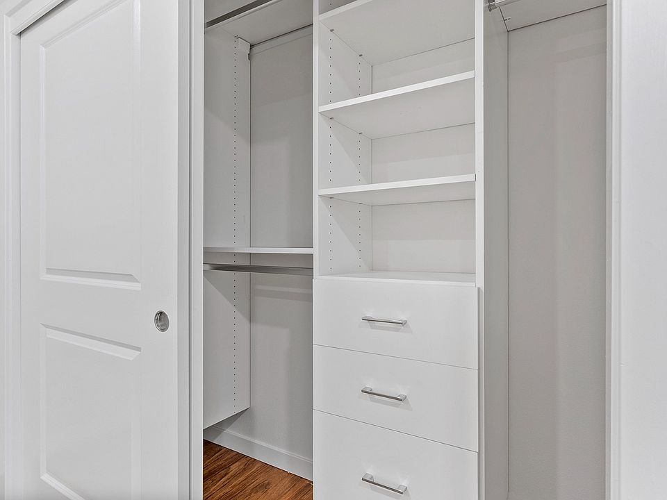 New custom closets with ample hanging and shelf space.