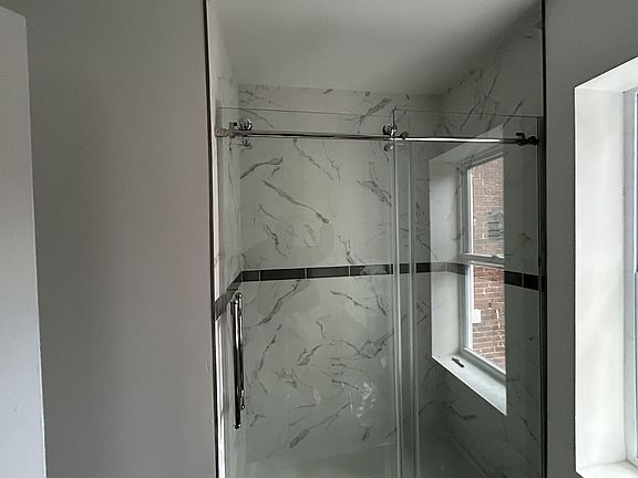 Tiled shower in Bathroom