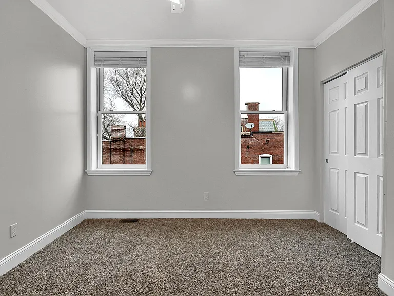 Bedroom 1 - level 2: 10' ceilings, large closet, ceiling fan, crown moulding