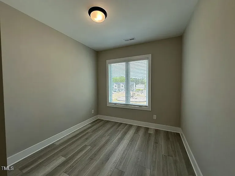 3rd bedroom with low maintenance LVP floors - perfect for office or beds