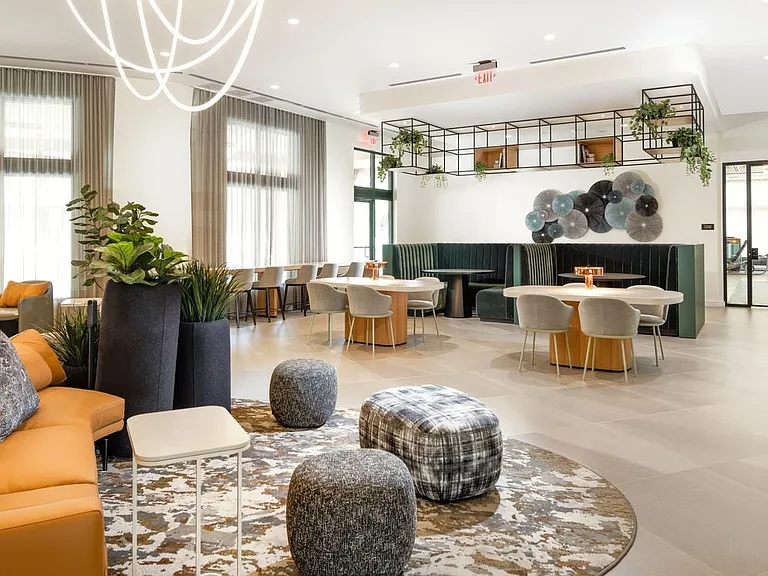 Resident lounge with coworking spaces and booths