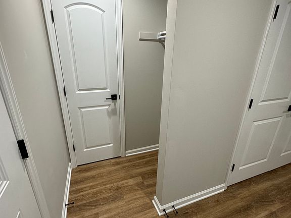 Two closets are located at the side door entrance.