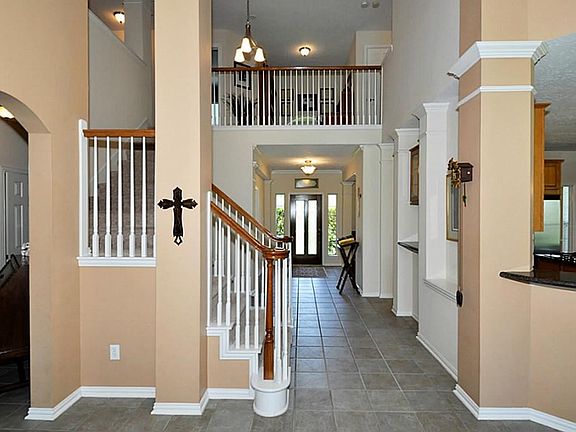 THE ENTRY HALL TO THIS BEAUTIFUL HOME! IT HAS  STONE TYPE LOOK CERAMIC TILE FLOORING. IT IS A WONDERFUL SPOT TO GREET GUEST & FAMILY!