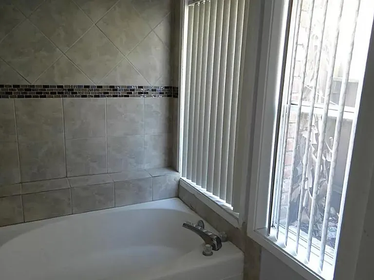 Garden tub with tile backdrop