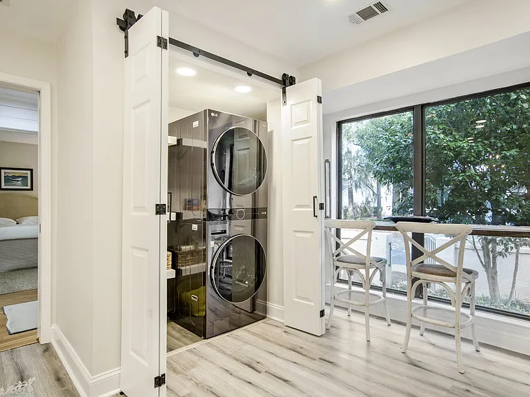 Breakfast Bar & A dedicated laundry space with brand-new, high-efficiency washer and dryer makes long stays easy and convenient. Tucked away behind stylish barn doors for a modern touch.