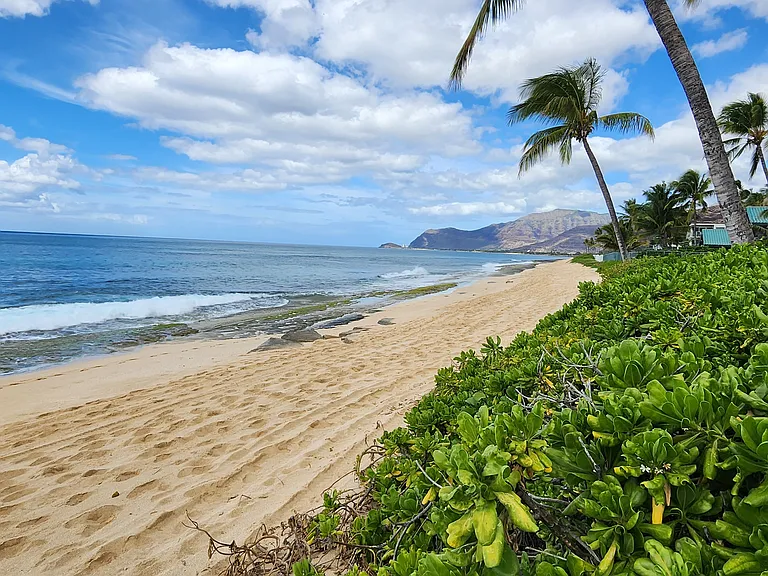 Beach to the right with private beach access/gate.
