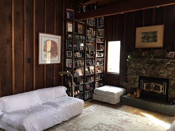 Floor to ceiling shelves for photos, books, collectables.