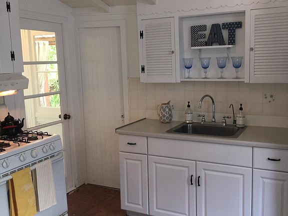 Leads to mud room and second bath