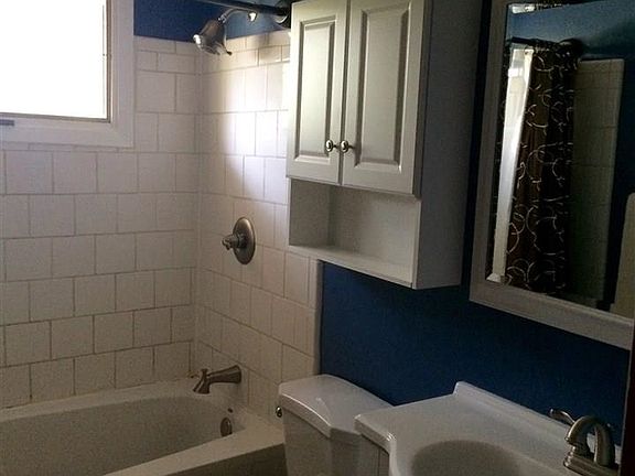 Updated bathroom with whirlpool tub.