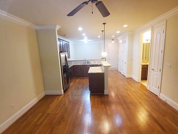 Open living room into kitchen.