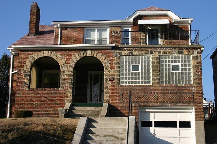 Solid brick, stone arches, 2nd level veranda with a view