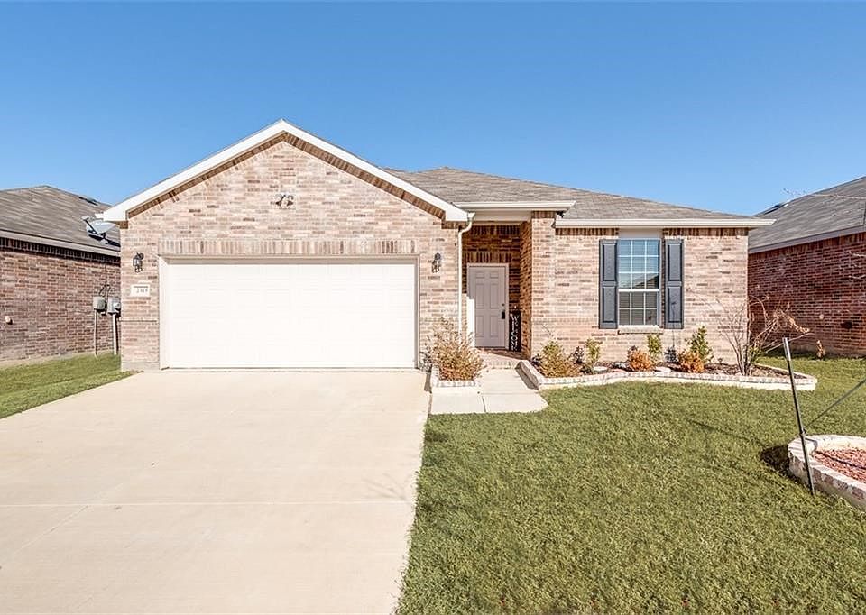 Nearly new one story brick home with covered porch, gutters, bordered plant beds located on an interior level lot.