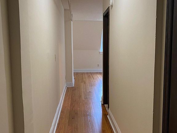 Hallway to the living/dining room and kitchen