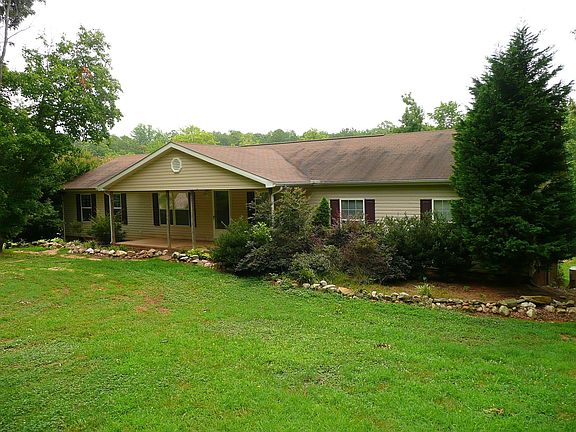 Large 4 bedroom ranch with porch, deck, gutters, vinyl siding
