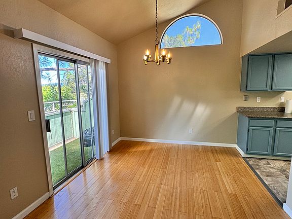 Living room area leading to the upstairs balcony