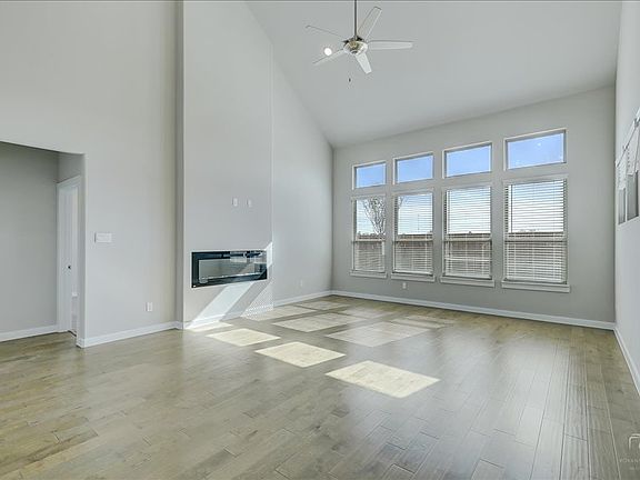 Living room in the Mercury home plan by Trophy Signature Homes - REPRESENTATIVE PHOTO
