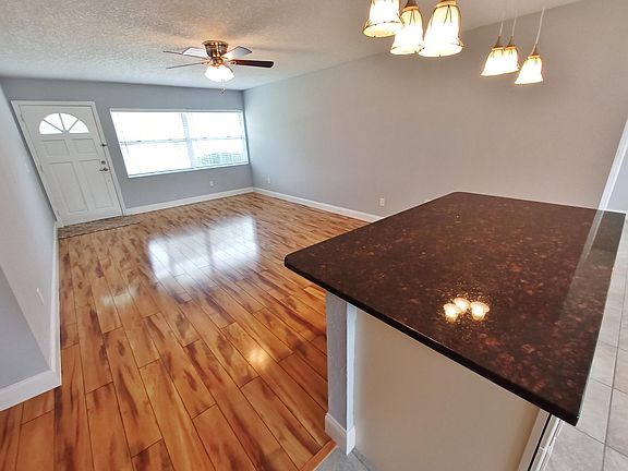 Living room with adjacent granite counter