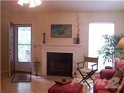 Open great room w/ fireplace, gas logs and vaulted ceiling