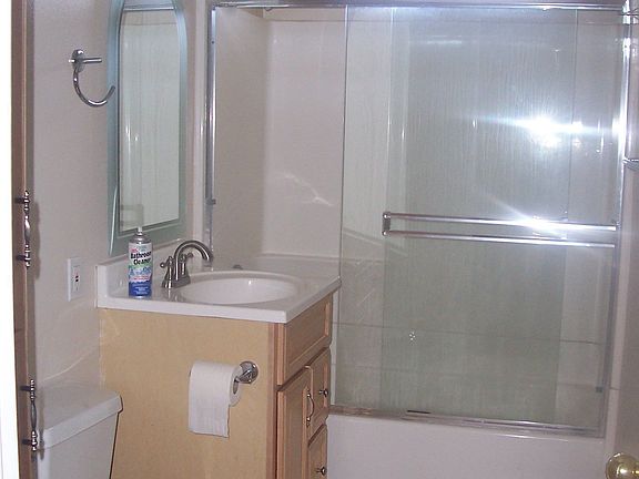 New bathroom with upgraded shower doors